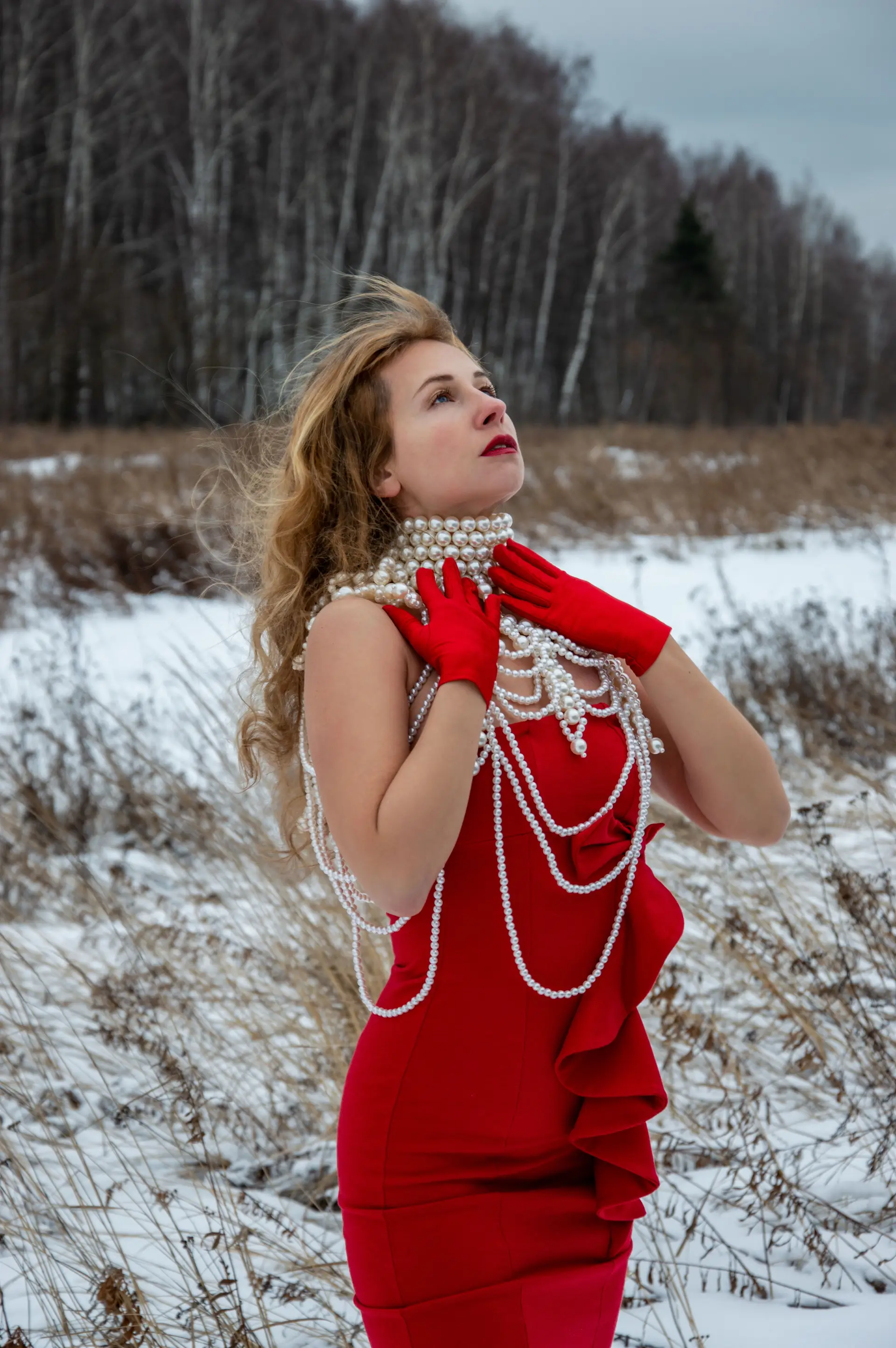 Elegant woman in pearls in a snowy Canadian landscape