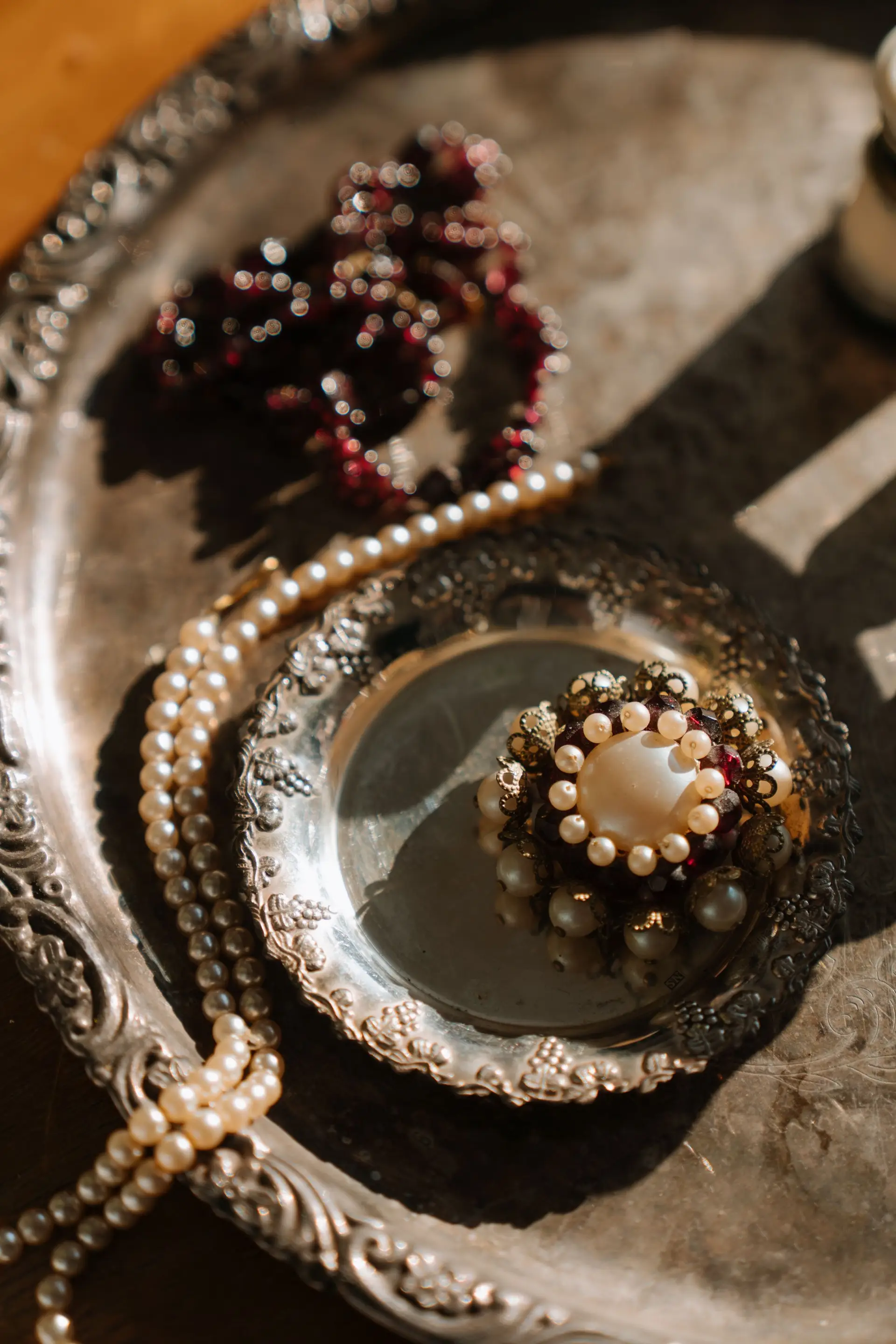 Silver and pearls in a vintage tray